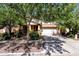 Charming two-story home featuring an attached two-car garage and mature landscaping in the front yard at 13722 N 150Th Ln, Surprise, AZ 85379