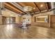 Spacious interior with wood floors, a long table, and access to an exterior patio at 13722 N 150Th Ln, Surprise, AZ 85379