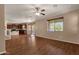 Inviting living room with hardwood floors and open access to the kitchen at 13722 N 150Th Ln, Surprise, AZ 85379