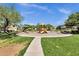 A neighborhood playground with slides and swings offers children a safe and fun place to play and make friends at 13722 N 150Th Ln, Surprise, AZ 85379