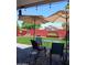 Charming backyard with artificial turf, seating, and brick wall at 14211 N 149Th Dr, Surprise, AZ 85379