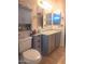 This bathroom offers a large vanity, ample storage, and a well-lit mirror for grooming at 14211 N 149Th Dr, Surprise, AZ 85379