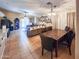 Open dining area with tile flooring, modern lighting, and seamless flow to the living room at 14211 N 149Th Dr, Surprise, AZ 85379