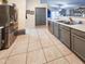 Functional kitchen featuring stainless steel appliances, neutral colors, and plenty of counter space at 14211 N 149Th Dr, Surprise, AZ 85379