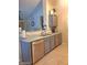 This kitchen boasts sleek gray cabinets, modern appliances, and a functional layout at 14211 N 149Th Dr, Surprise, AZ 85379