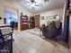 Comfortable living room featuring tile floors, neutral paint, ceiling fan, and an elegant rug at 14211 N 149Th Dr, Surprise, AZ 85379