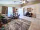 Bright living room showcasing tile floors, neutral walls, and plush seating for relaxation at 14211 N 149Th Dr, Surprise, AZ 85379