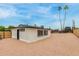 A view of the backyard with desert landscaping under a beautiful sky at 1515 N Saguaro Dr, Tempe, AZ 85288