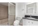 Bathroom featuring a tiled shower and granite countertops at 1515 N Saguaro Dr, Tempe, AZ 85288
