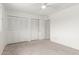 Bedroom with white closet doors and neutral carpet at 1515 N Saguaro Dr, Tempe, AZ 85288