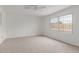 Bright, carpeted bedroom with large window allowing natural light and ventilation at 1515 N Saguaro Dr, Tempe, AZ 85288