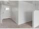 Inviting entryway featuring neutral carpet, white walls, and a white front door at 1515 N Saguaro Dr, Tempe, AZ 85288