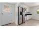 Kitchen featuring stainless steel refrigerator and white cabinetry at 1515 N Saguaro Dr, Tempe, AZ 85288