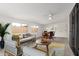 Staged living room with modern furniture and carpeted floors at 1515 N Saguaro Dr, Tempe, AZ 85288