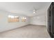 Bright, carpeted living room with windows offering plenty of natural light at 1515 N Saguaro Dr, Tempe, AZ 85288