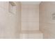 Tiled stand up shower featuring a built in bench and corner shelf at 1515 N Saguaro Dr, Tempe, AZ 85288