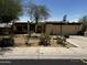 Single-story home with stucco siding, flat roof, attached garage, and xeriscaped front yard at 1541 E Las Palmaritas Dr, Phoenix, AZ 85020
