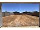 Unfinished backyard with block fence, ready for your landscape design at 15785 W Beryl Ave, Waddell, AZ 85355