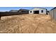 Large backyard features a block fence and is ready for your landscape design at 15785 W Beryl Ave, Waddell, AZ 85355