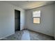 This bedroom has a closet, a window for natural light, and neutral carpeting at 15785 W Beryl Ave, Waddell, AZ 85355