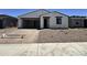Charming single-story home with a stucco facade, a two-car garage, and low-maintenance landscaping at 15785 W Beryl Ave, Waddell, AZ 85355