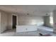 Bright living room with smooth concrete floors and neutral walls, providing ample space and natural light at 15785 W Beryl Ave, Waddell, AZ 85355