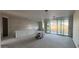 Spacious living room featuring neutral walls and large sliding doors providing ample natural light at 15785 W Beryl Ave, Waddell, AZ 85355