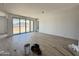 Large, sunny living room with sliding doors to the yard, highlighting tile floors and an open layout at 15785 W Beryl Ave, Waddell, AZ 85355