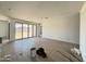 Spacious living area with tile floors and large sliding doors offering backyard access and ample natural light at 15785 W Beryl Ave, Waddell, AZ 85355