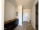 Mud room features new cabinets, flooring and a view to the utility area at 15785 W Beryl Ave, Waddell, AZ 85355