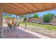 Backyard with a covered patio, block fencing, and landscaping at 16421 N 65Th Pl, Scottsdale, AZ 85254