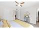 Cozy bedroom with ceiling fan, neutral carpet, and charming decor at 16421 N 65Th Pl, Scottsdale, AZ 85254
