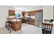 Well-appointed kitchen features wood cabinets, granite countertops, and stainless steel appliances at 16421 N 65Th Pl, Scottsdale, AZ 85254