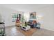 Bright living room with tiled floors, large windows, and comfortable seating at 16421 N 65Th Pl, Scottsdale, AZ 85254
