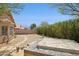 Spacious backyard featuring desert landscaping, a covered jacuzzi, and a charming stone walkway at 17141 E Rockwood Dr, Fountain Hills, AZ 85268