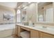 The bathroom has a soaking tub, dual vanities, and lots of natural light from the windows at 17141 E Rockwood Dr, Fountain Hills, AZ 85268