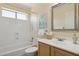 Clean bathroom with a shower-tub combo, vanity, and a stylish mirror at 17141 E Rockwood Dr, Fountain Hills, AZ 85268