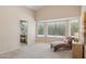 Bright bedroom featuring ample windows, natural light, and an ensuite bathroom for added privacy and convenience at 17141 E Rockwood Dr, Fountain Hills, AZ 85268
