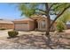 Inviting single-story home with a well-manicured yard and a spacious two-car garage at 17141 E Rockwood Dr, Fountain Hills, AZ 85268