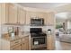 A kitchen features granite countertops, stainless steel appliances, and a seamless transition into an adjoining living area at 17141 E Rockwood Dr, Fountain Hills, AZ 85268