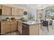 Well-lit kitchen with granite countertops, stainless steel appliances, and an adjacent breakfast nook with ample seating at 17141 E Rockwood Dr, Fountain Hills, AZ 85268