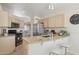 Modern kitchen with granite countertops, stainless steel appliances, and breakfast bar seating for casual dining at 17141 E Rockwood Dr, Fountain Hills, AZ 85268