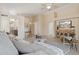 Spacious living room featuring neutral colors, tile flooring, and a view into the kitchen and dining areas at 17141 E Rockwood Dr, Fountain Hills, AZ 85268
