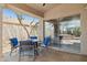 Covered patio with a seating area, tiled flooring, and a view of the landscaped backyard at 17141 E Rockwood Dr, Fountain Hills, AZ 85268