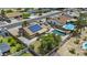 Aerial view of a home with a private backyard oasis, featuring a sparkling pool and lush green landscaping at 17244 N 29Th Ave, Phoenix, AZ 85053