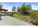 Expansive backyard with lush lawn, mature trees, and covered patio for relaxation at 17244 N 29Th Ave, Phoenix, AZ 85053