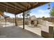 Enjoy outdoor living with a built-in fireplace and seating area in this backyard at 17244 N 29Th Ave, Phoenix, AZ 85053