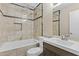 Stylish bathroom featuring modern fixtures and elegant tile work in the shower and vanity at 17244 N 29Th Ave, Phoenix, AZ 85053