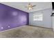 Large bedroom with a ceiling fan, window, and carpeted floors at 17244 N 29Th Ave, Phoenix, AZ 85053