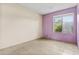 Spacious bedroom featuring neutral tile flooring and a bright window at 17244 N 29Th Ave, Phoenix, AZ 85053